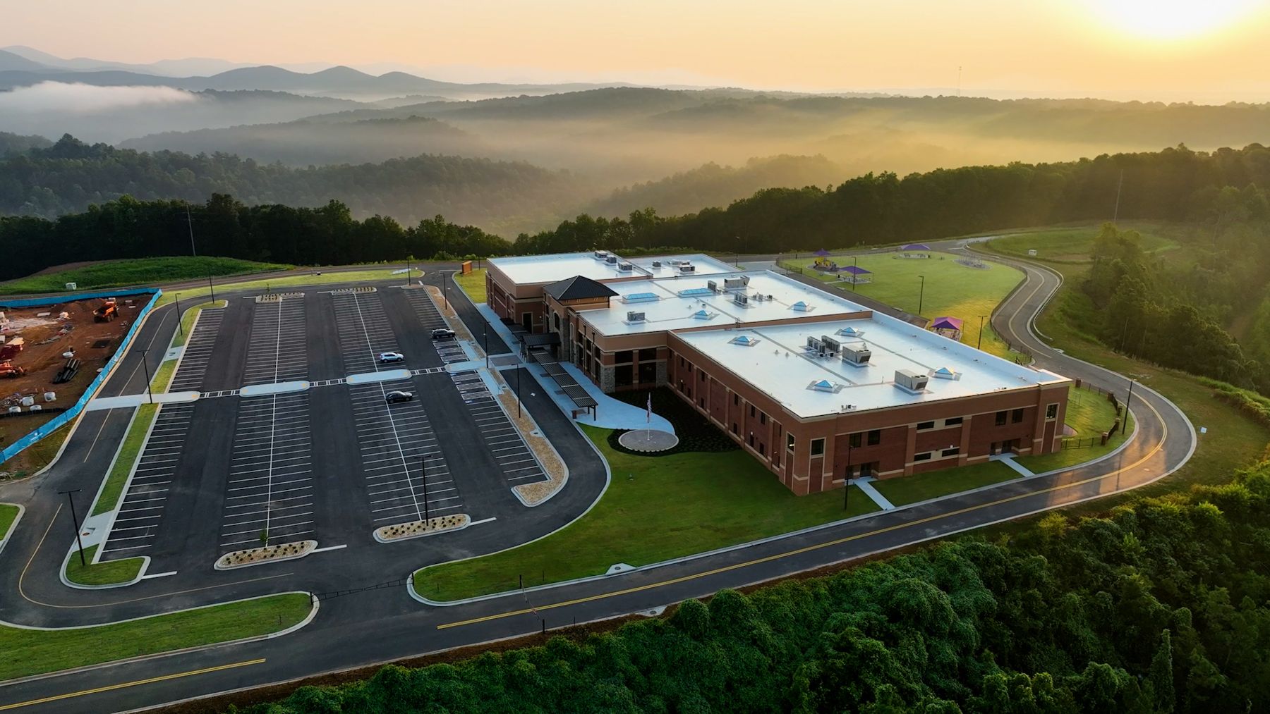 Cottrell Elementary School at sunrise with the mountains behind